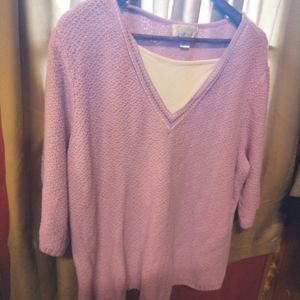C.J.Banks lavender sweater with three-quarter inch sleeves and V neck.